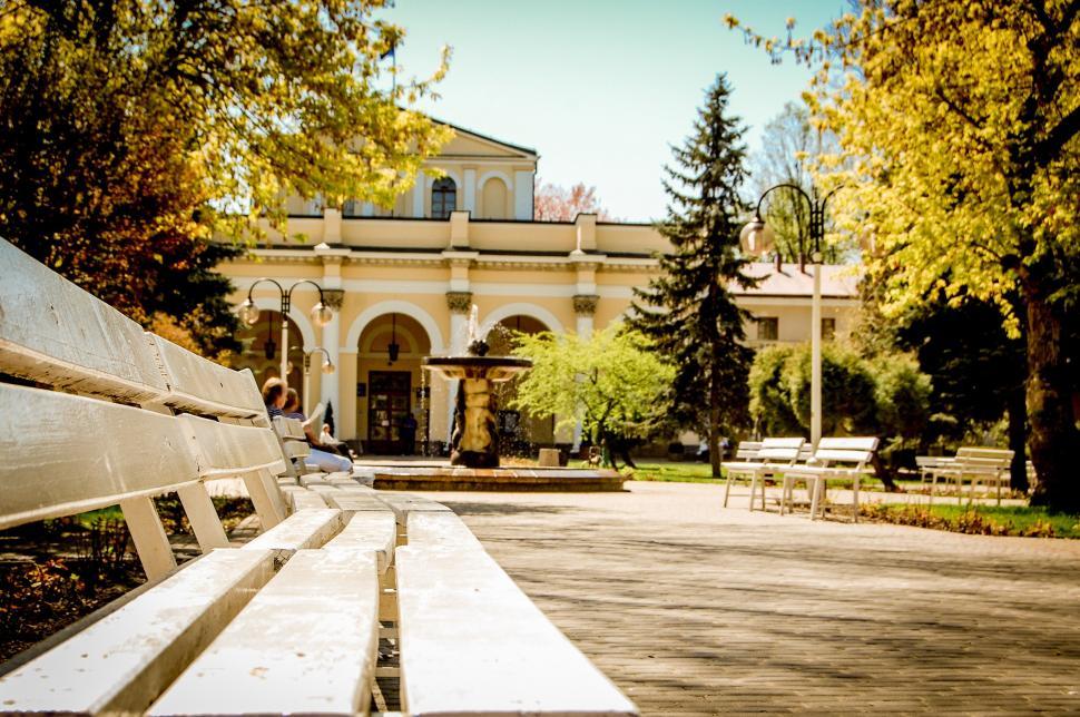 Free Image of Wooden Bench in Front of Building 