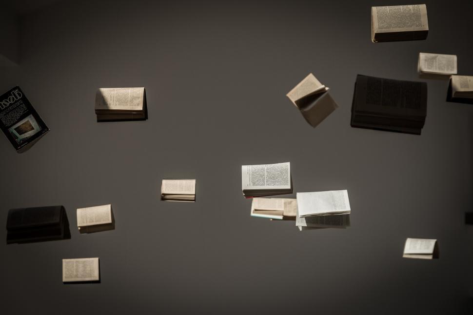 Free Image of A Pile of Black and White Paper Sheets 