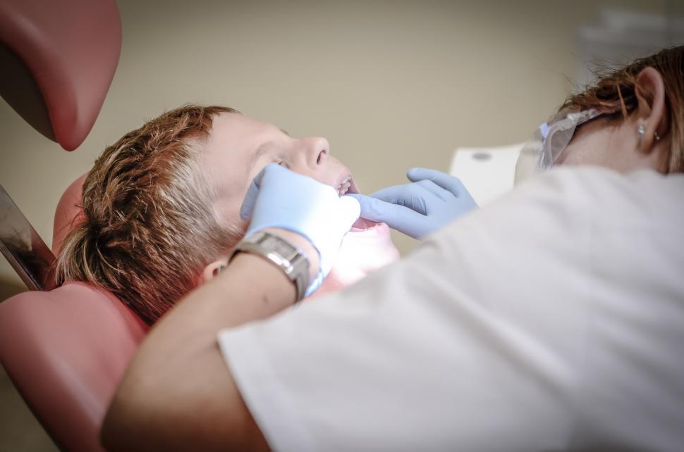 Free Image of Man Laying in Hospital Bed With Little Boy 