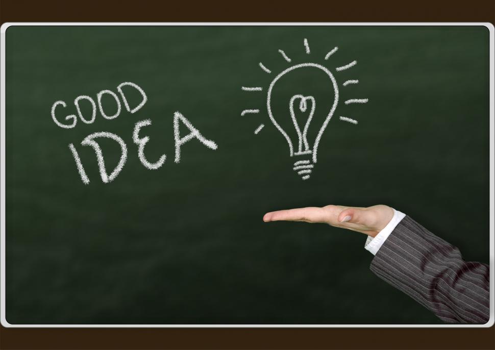 Free Image of Hand Pointing at Chalk Board With Light Bulb Drawing 
