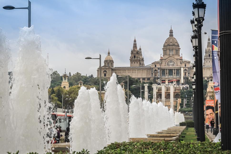 Free Image of Group of Water Fountains in Front of Building 