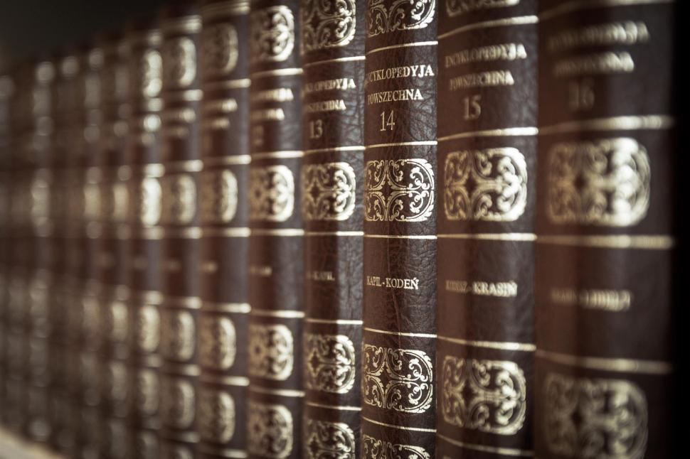 Free Image of A Row of Books on a Shelf 