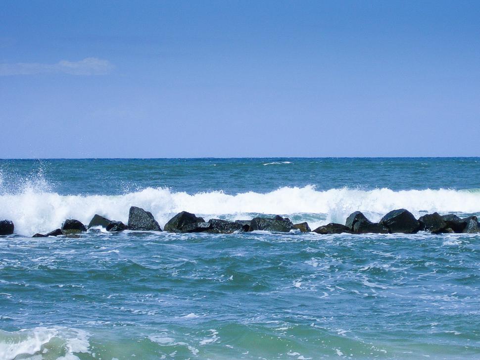 Free Image of Man Riding Surfboard on Top of Ocean Wave 