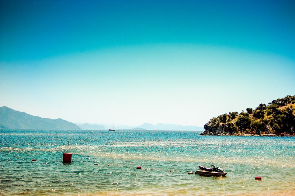 Free Image of Small Boat Sailing on Open Water 