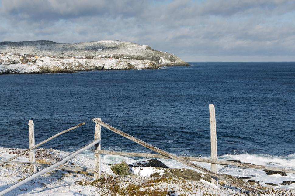 Free Image of Snow covered grass and fence 