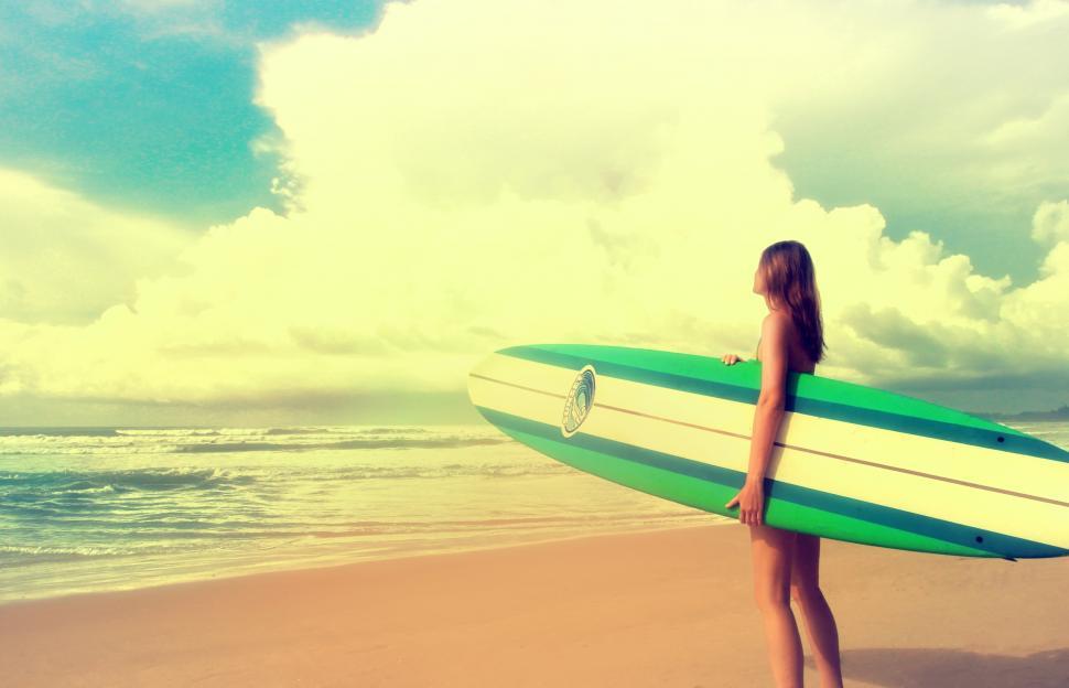 Free Image of Up to the Challenge - Woman with Surfboard ready to Surf - Vinta 