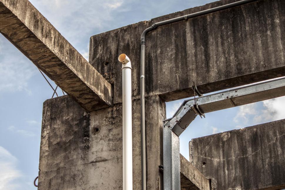 Free Stock Photo of Industrial exhaust and conduits on pillar