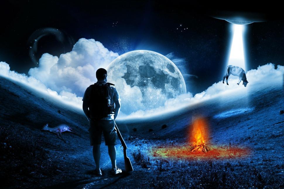 Free Image of Man Standing in the Middle of a Field 
