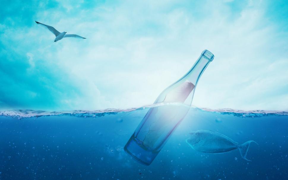 Free Image of Bottle Floating on Top of Body of Water 