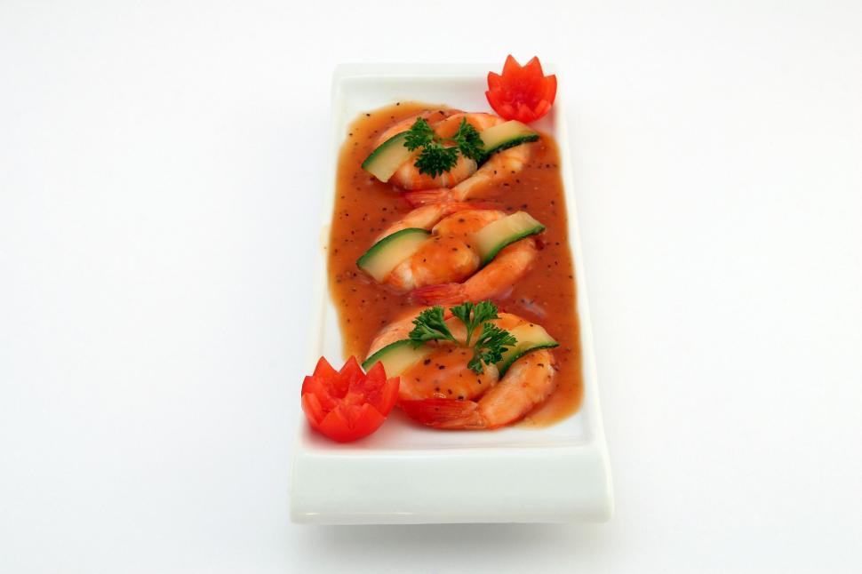Free Image of White Plate With Food Covered in Sauce 