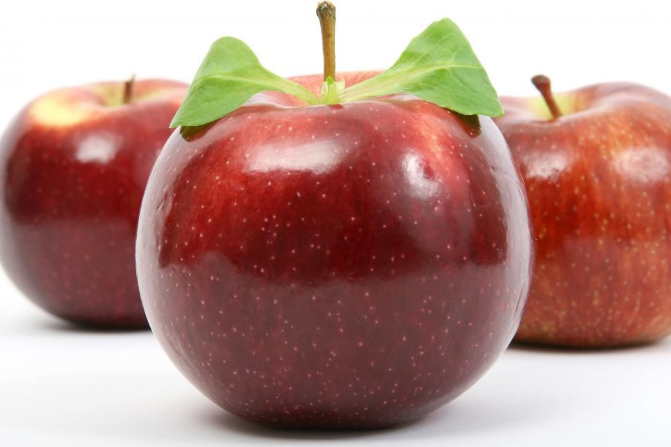 Free Image of Three Red Apples With a Green Leaf 