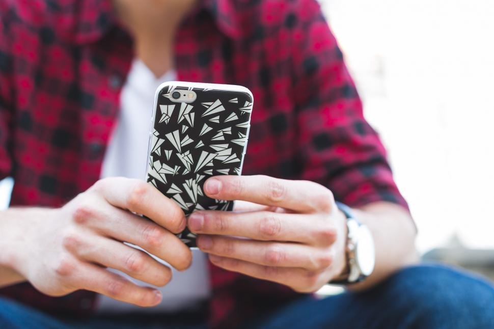 Free Image of Teen Texting On Smartphone 