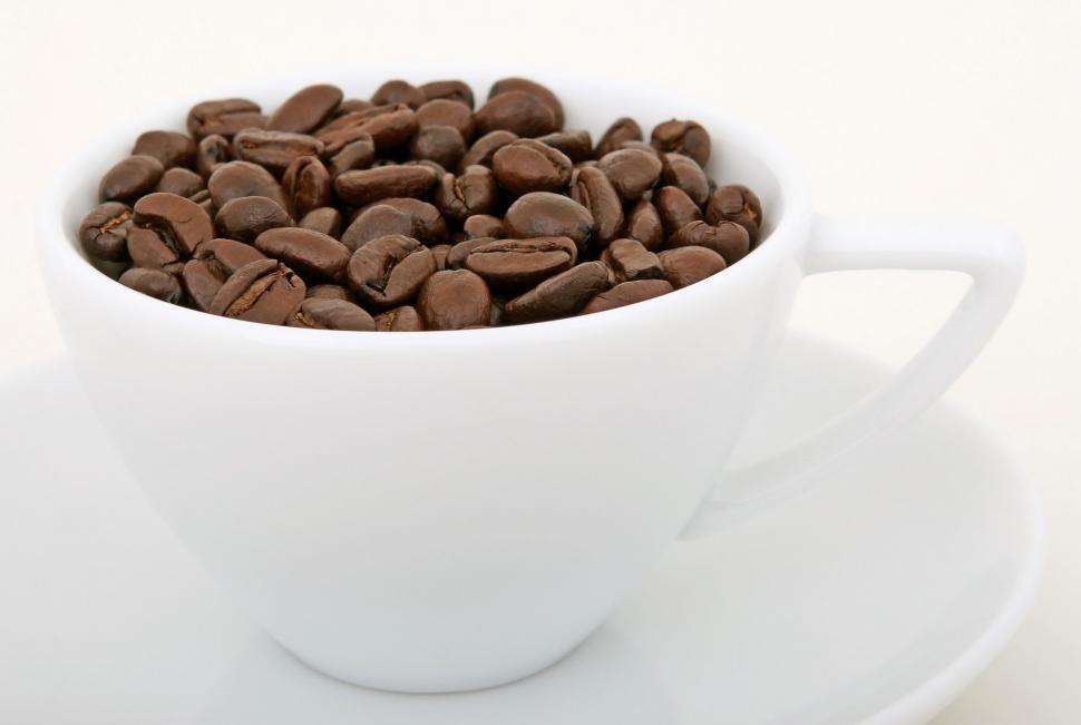 Free Image of White Cup Filled With Coffee Beans on Saucer 