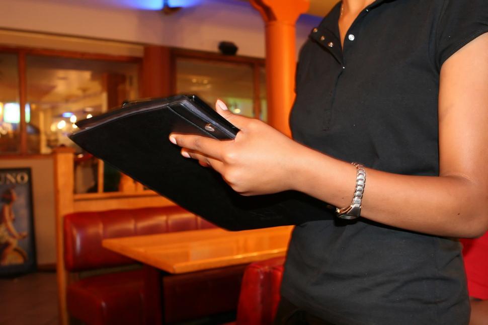 Free Image of Woman Holding Black Folder 