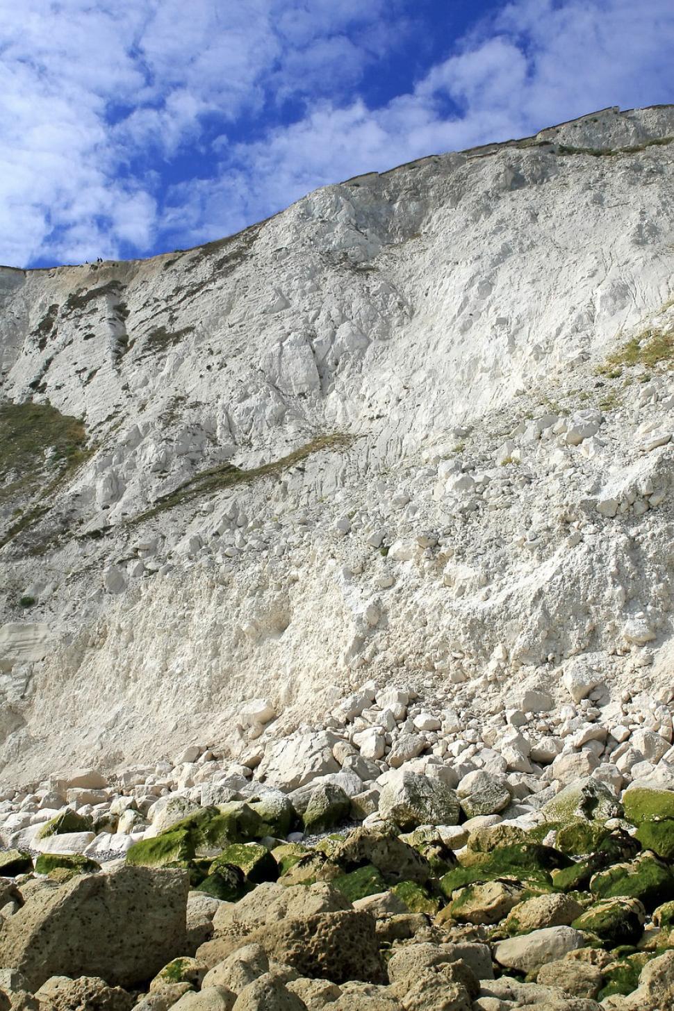 Free Image of Man Standing on Rocky Hillside 