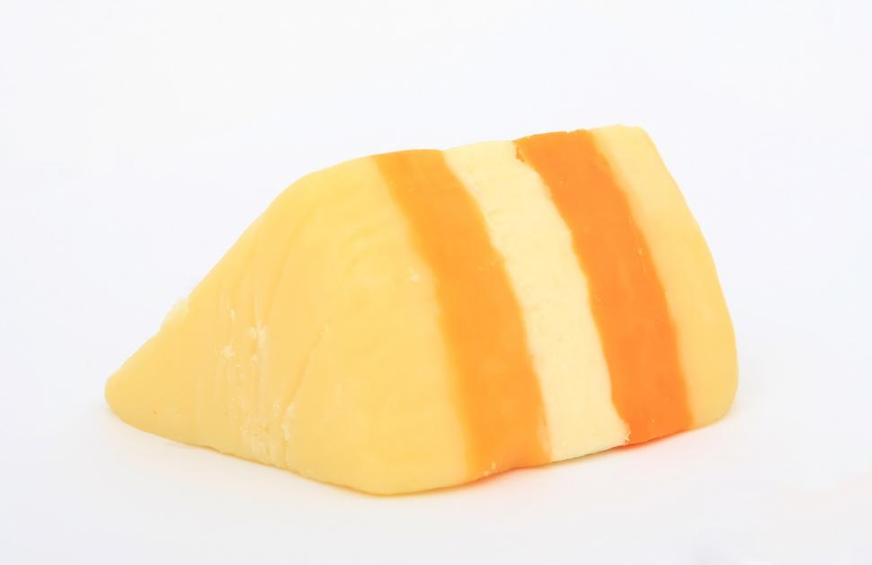 Free Image of Orange and White Striped Pillow on White Surface 