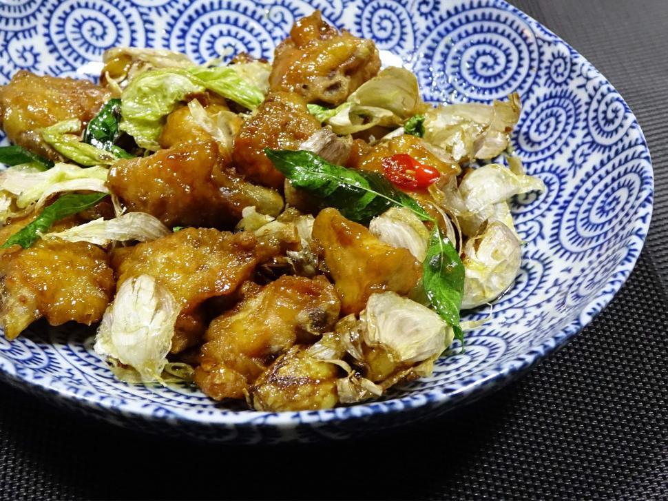 Free Image of Blue and White Bowl Filled With Food on Table 