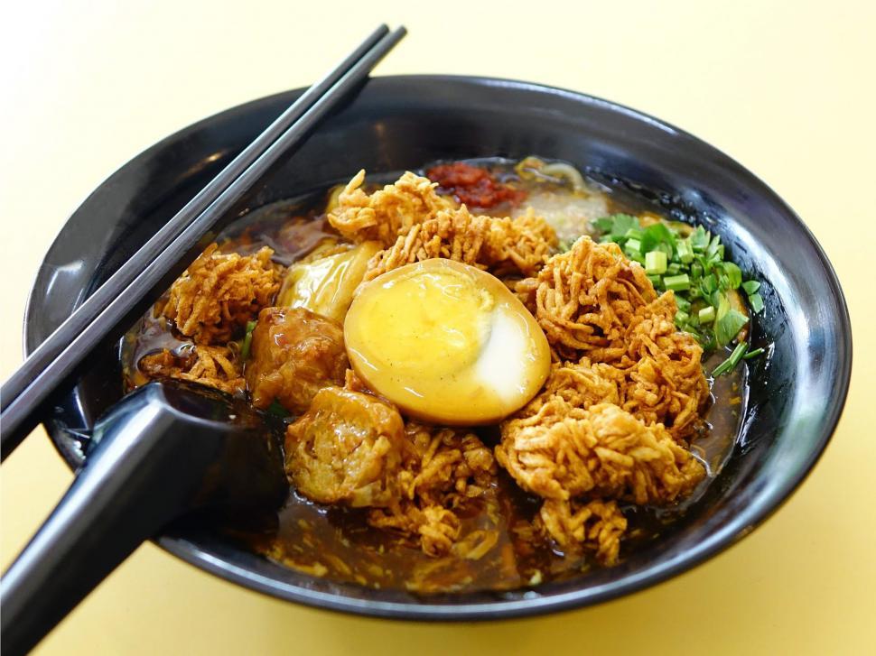 Free Image of Bowl of Food With Chopsticks on Table 