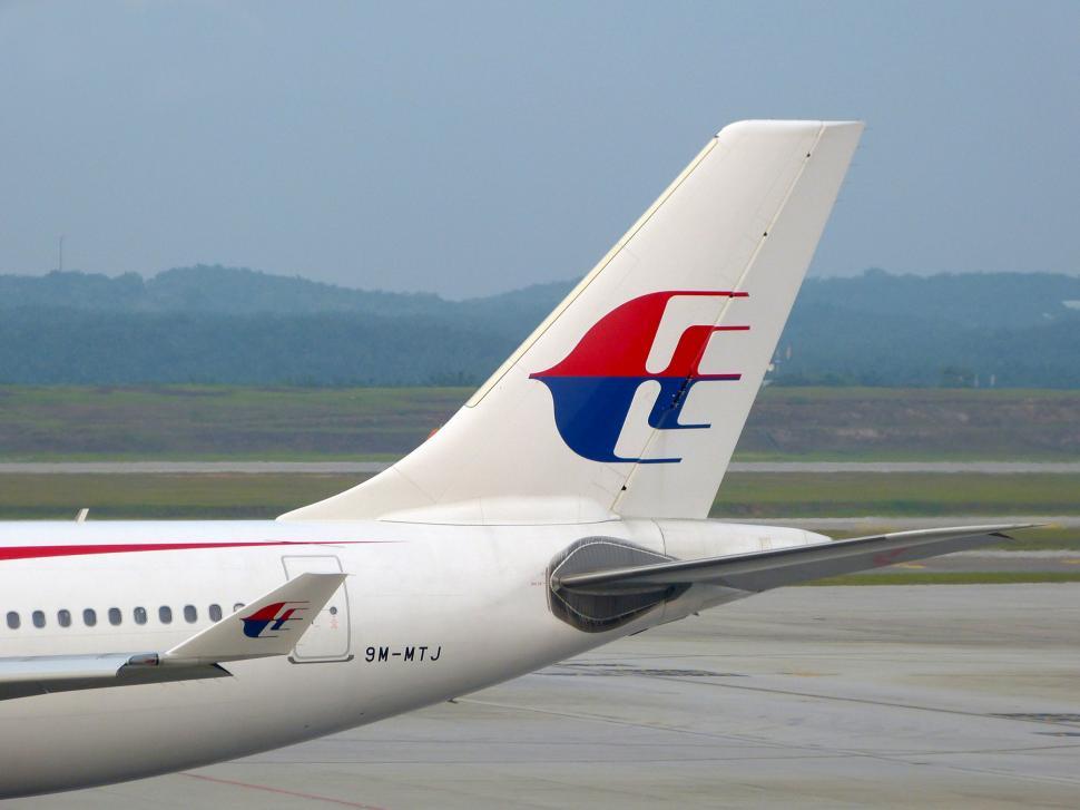 Free Image of Large Jetliner Parked on Airport Tarmac 