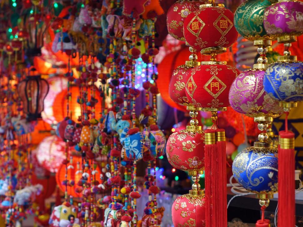 Free Image of Red and Blue Ornaments Hanging on Wall 