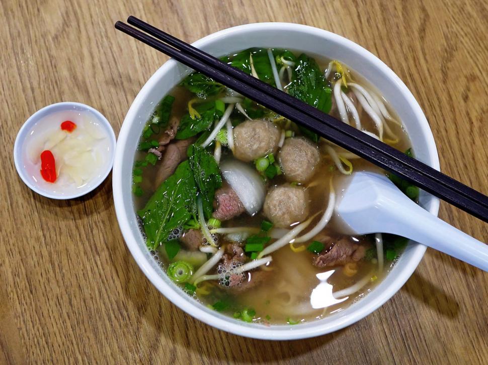Free Image of Bowl of Soup With Chopsticks on Table 