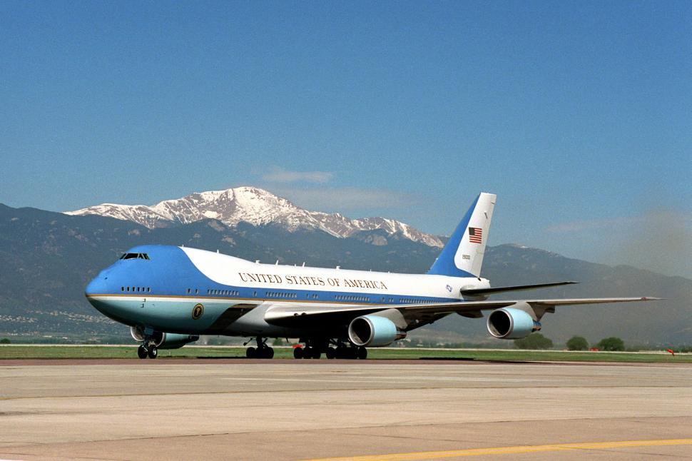 Free Image of Large Blue and White Jetliner on Airport Runway 