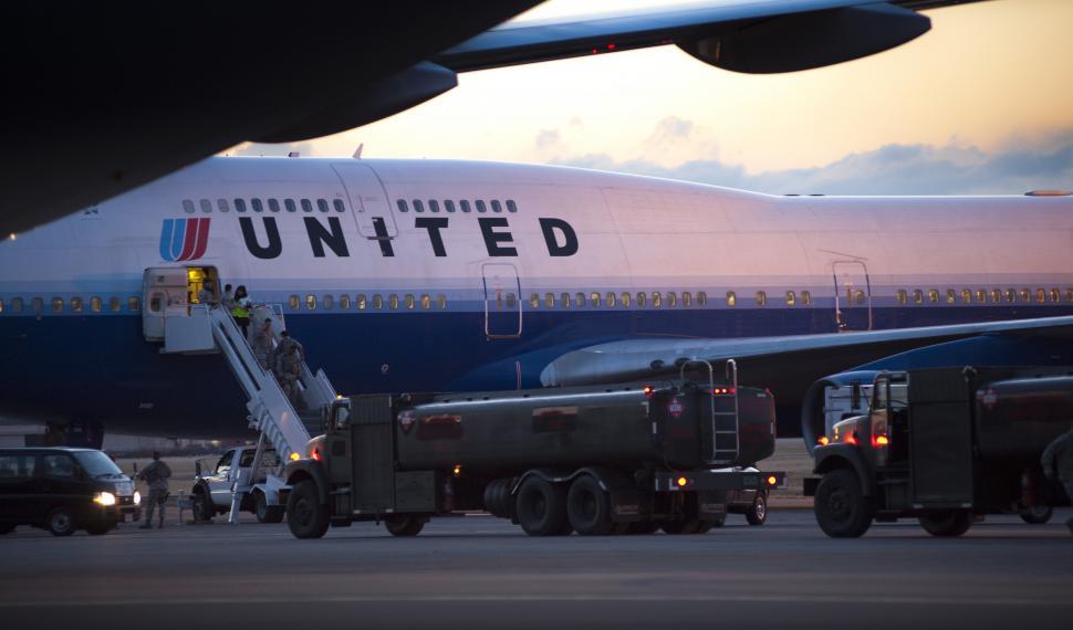 Free Image of Large Jetliner Parked on Airport Tarmac 