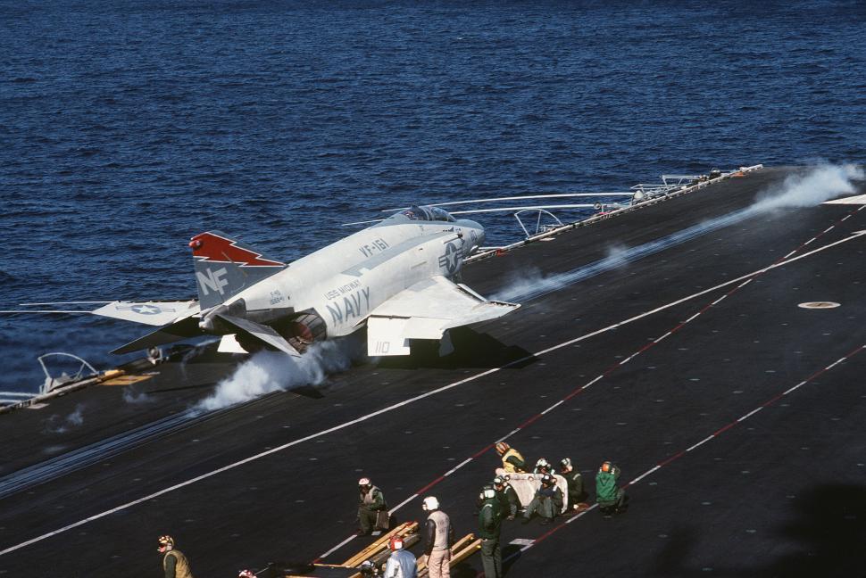 Free Image of Fighter Jet Positioned on Aircraft Carrier Ready for Takeoff 