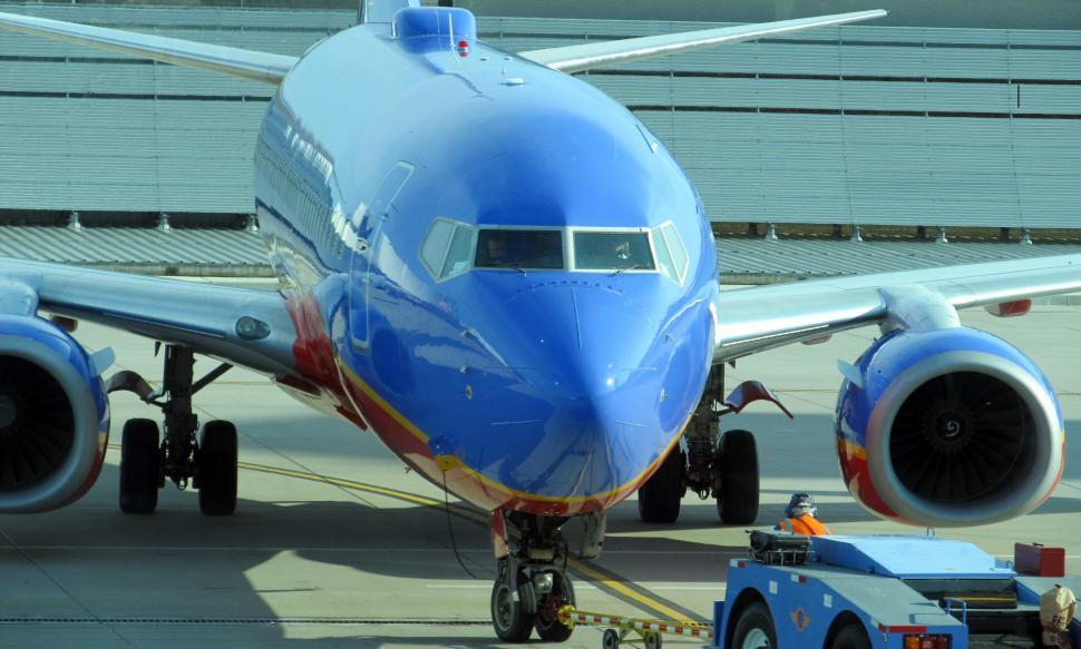 Free Image of Large Jetliner Parked on Airport Tarmac 