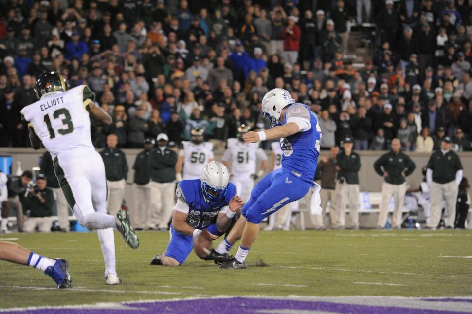 Free Image of Football Player Running With Ball in Game 