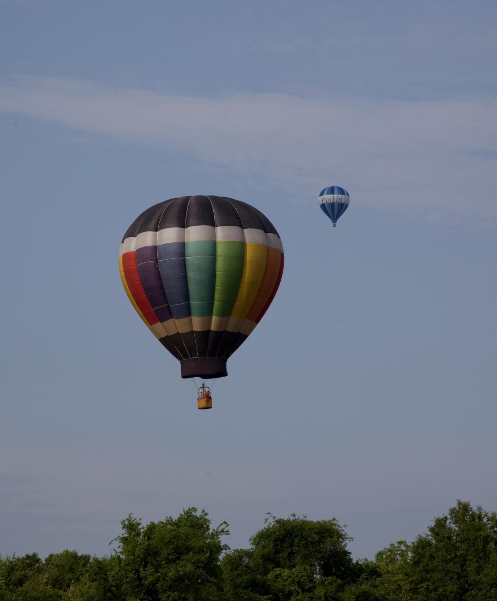 Free Image of Hot Air Balloons Flying Through Blue Sky 