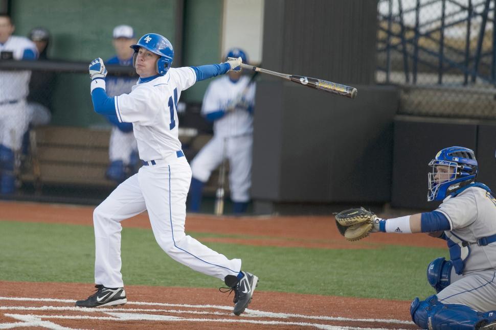 Free Image of Baseball Player Swinging Bat on Field 