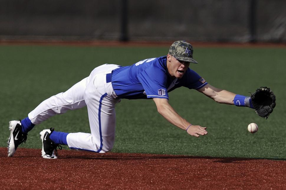 Free Image of Baseball Player Diving for Ball on Field 