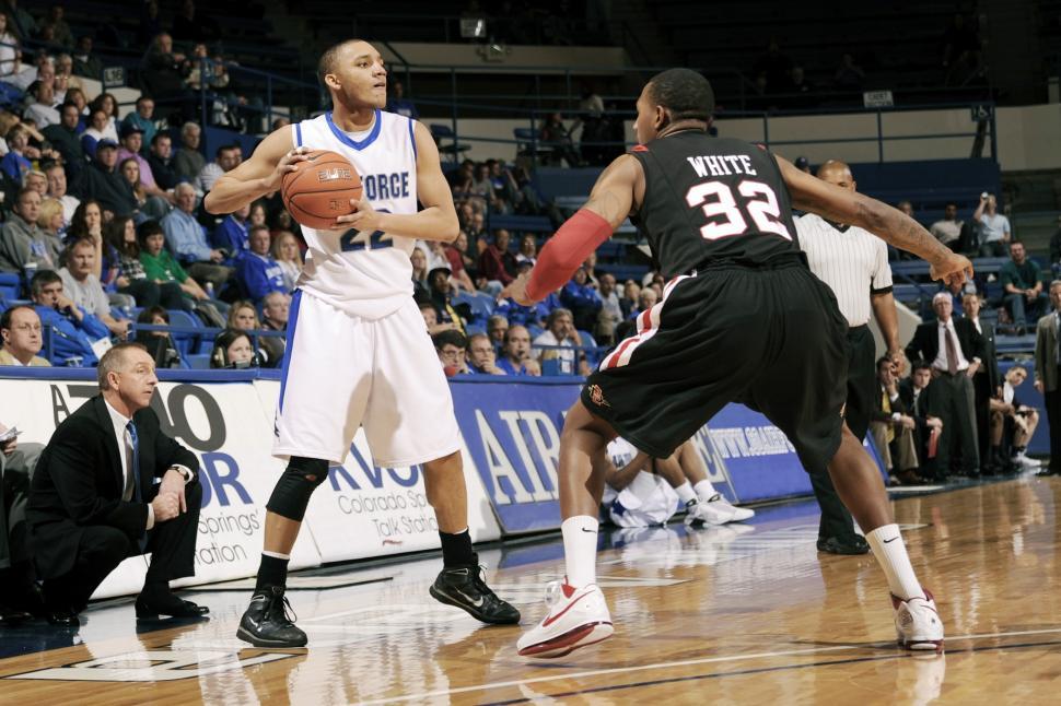 Free Image of Group of Men Playing a Game of Basketball 