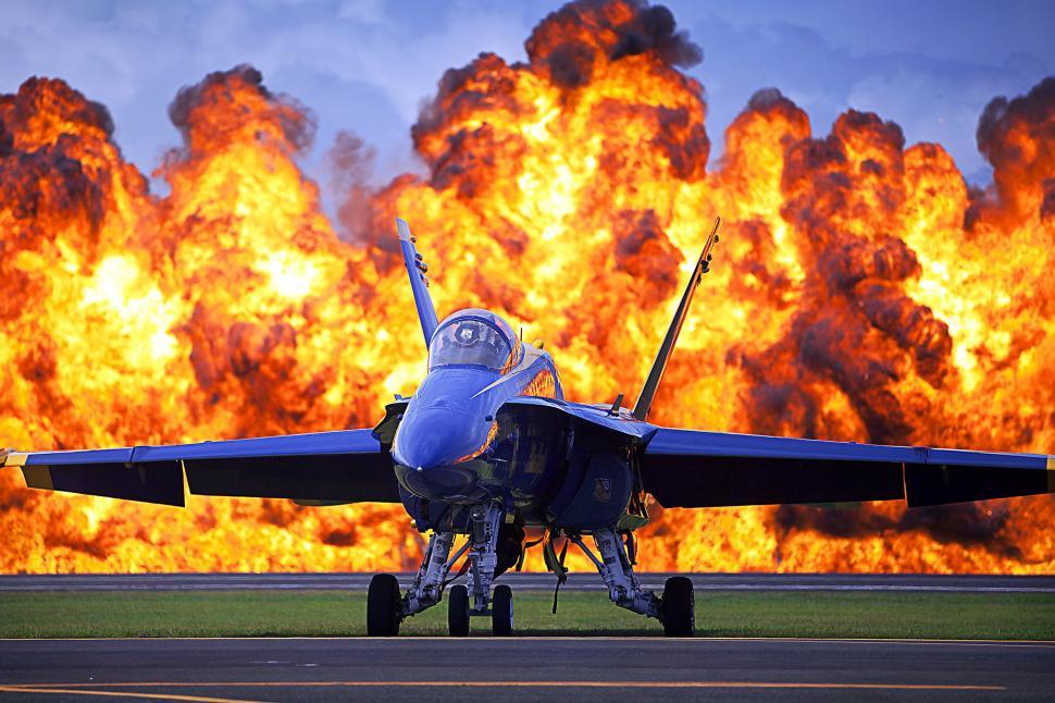 Free Image of Fighter Jet Parked on Airport Runway 
