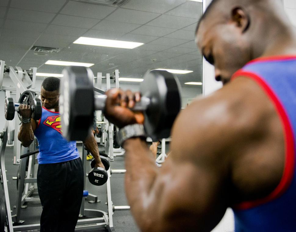 Free Image of Man Holding Dumbbell in Gym 