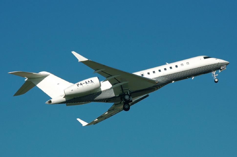 Free Image of Large Jetliner Flying Through Blue Sky 