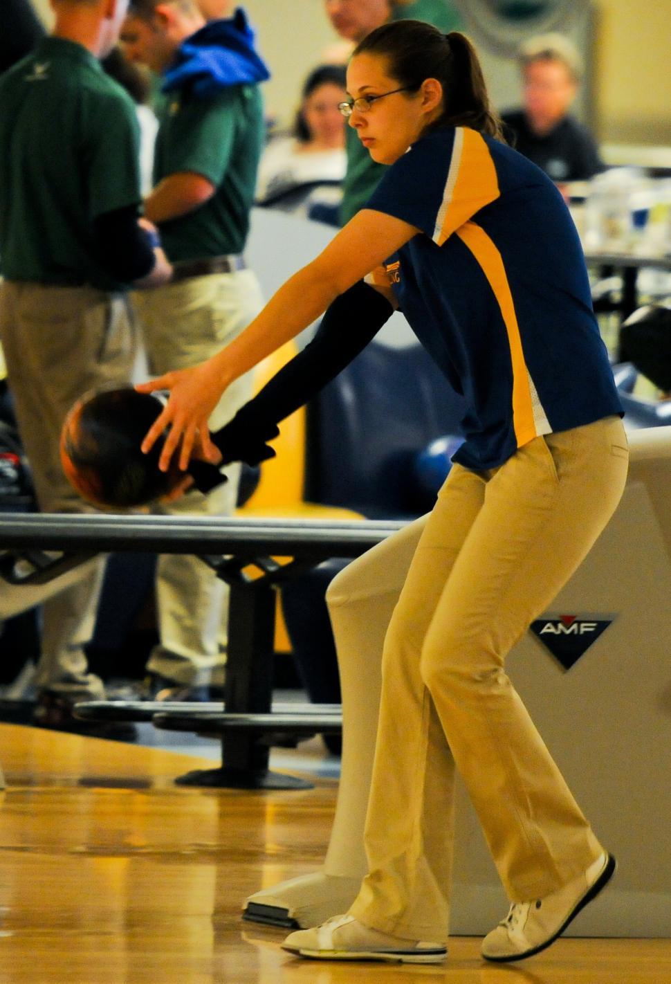 Free Image of Woman in Blue and Yellow Shirt Riding Skateboard 