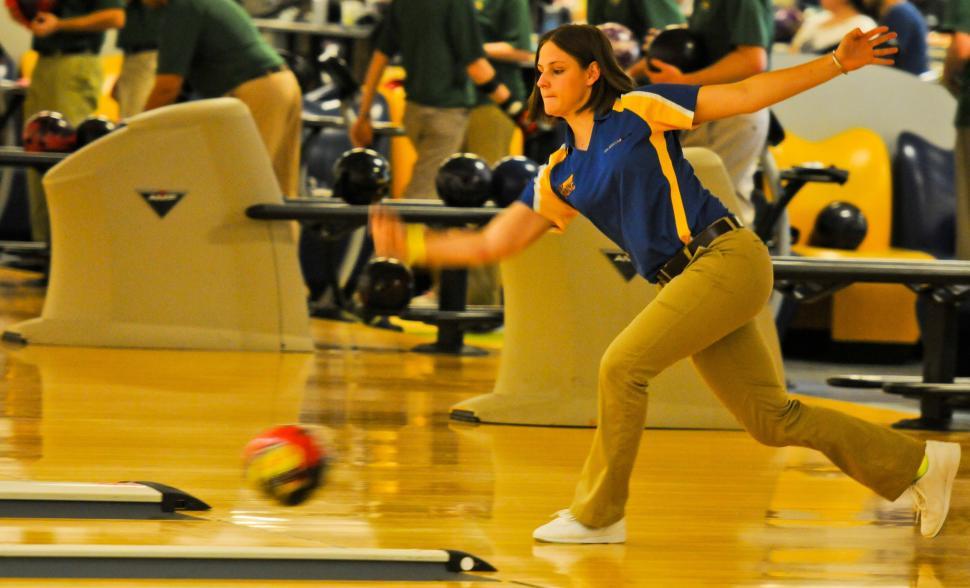Free Image of Woman Bowling in Alley 