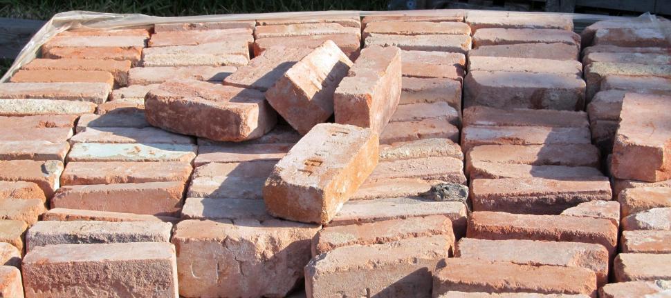 Free Image of Pile of Bricks on Sidewalk 