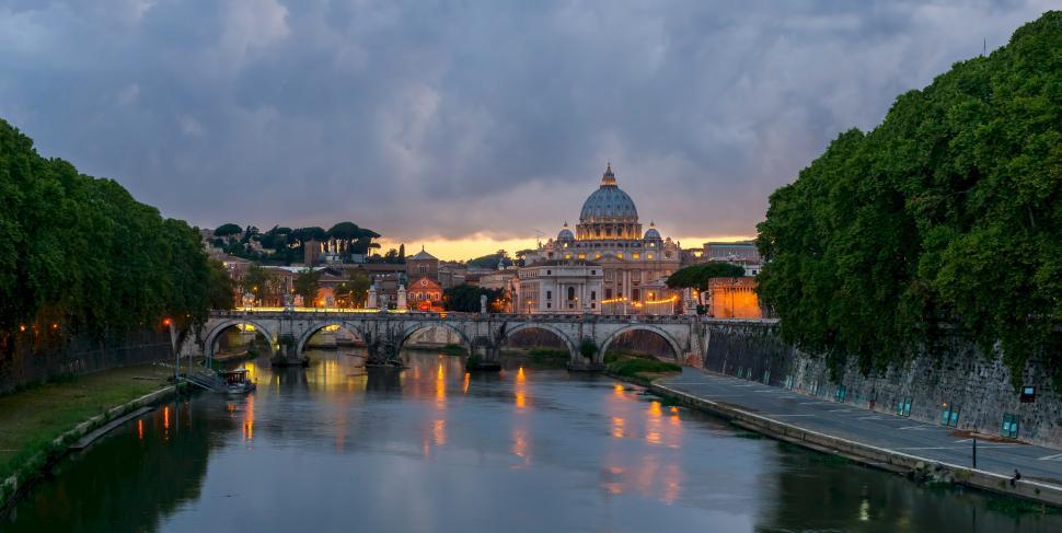 Free Image of River Flowing Through City Next to Bridge 