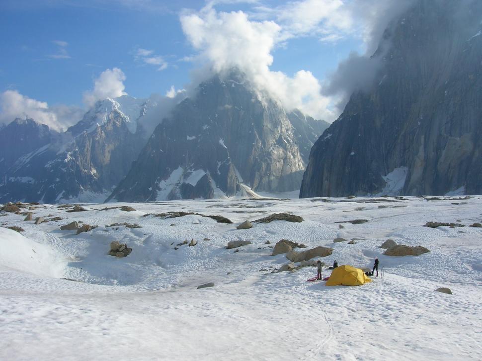 Free Image of Tent in Snow With Mountain Background 