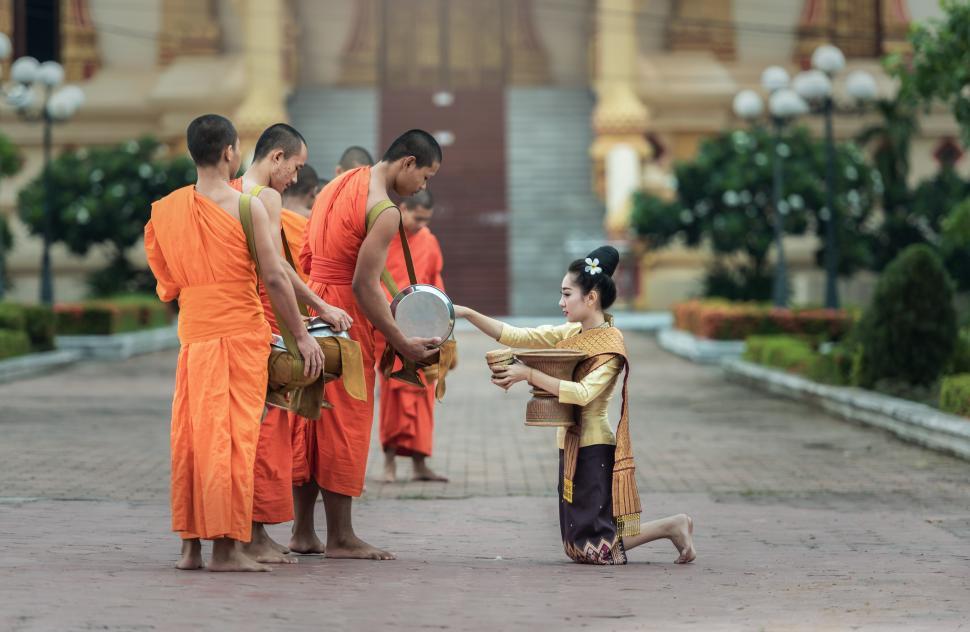 Free Image of Group of Men Standing Around Holding a Frisbee 
