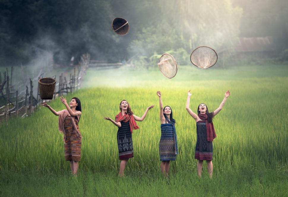 Free Image of Group of Women Standing on Lush Green Field 