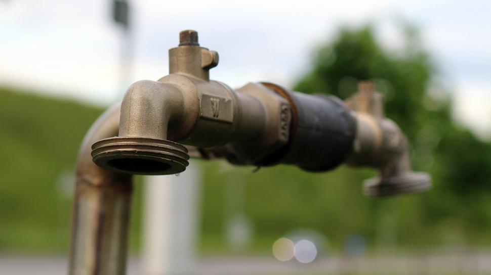 Free Image of Close Up of Water Faucet With Blurry Background 