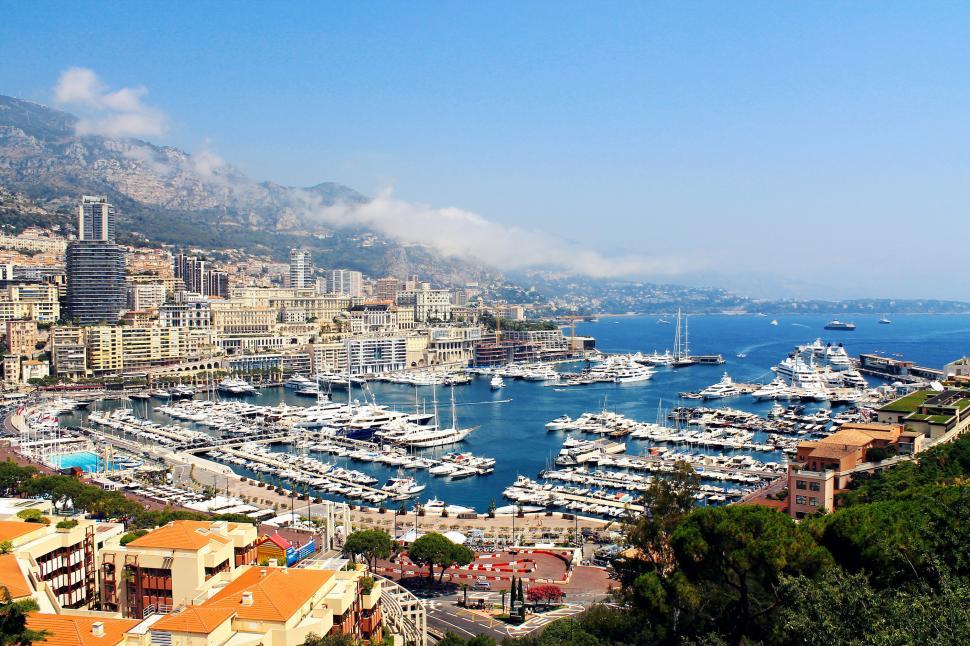 Free Image of Bustling Harbor Filled With Boats Next to City 