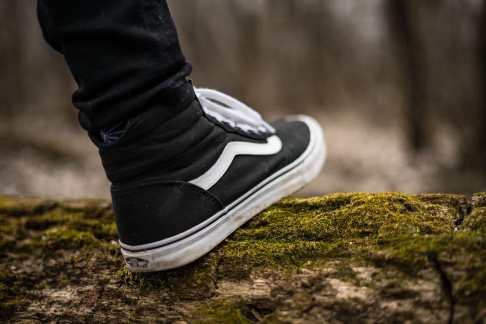 Free Image of Person Standing on Moss Covered Rock 