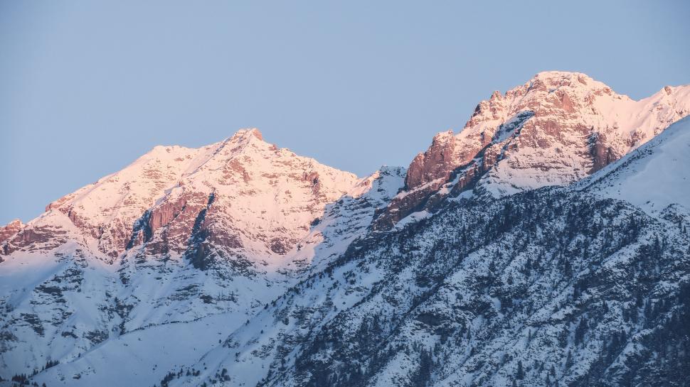 Free Image of Snow Covered Mountain With Blue Sky 