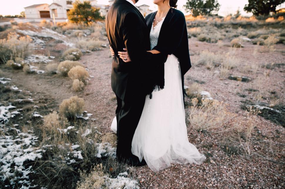 Free Image of Man and Woman Standing in Field 