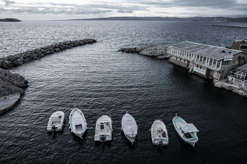 Free Image of Group of Small Boats on Body of Water 